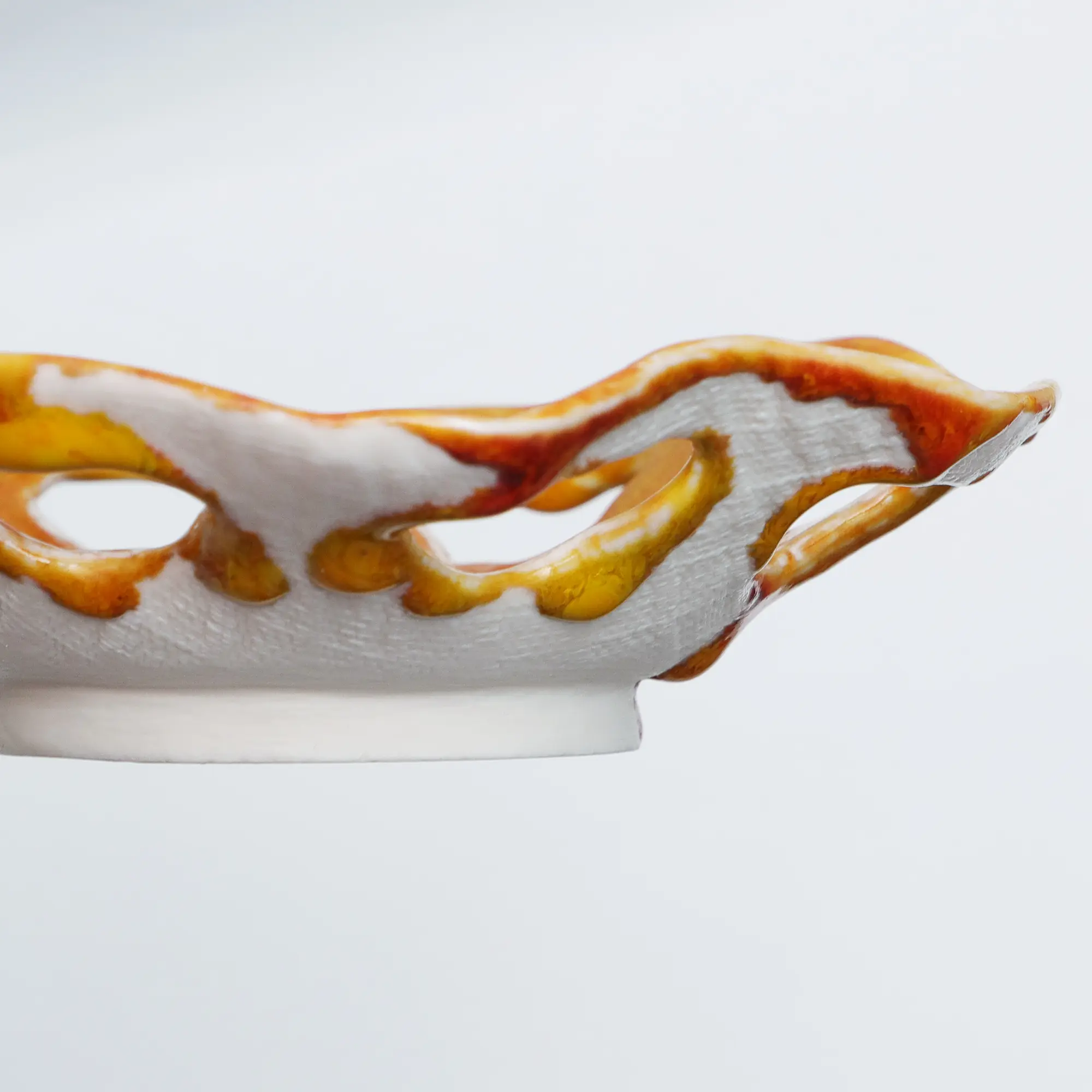 Nahaufnahme XS kleine runde Weichporzellan Schale orange weiss Deko Kunst abstrakt festlich